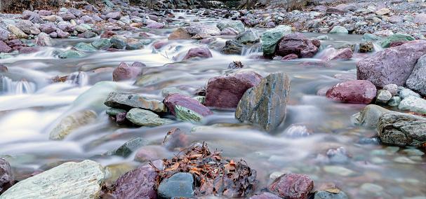 Water flows freely over the beautiful rocks in a river in Montana