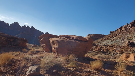 Stunning Red Rock formations abound on the trail to the Gemini Bridges in Canyonlands State Park in Utah