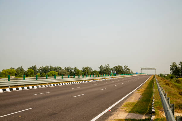 istock highway road against overcast sky. 1893612974