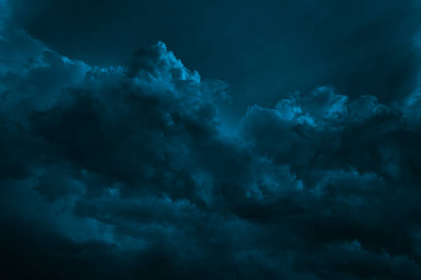 istock Black dark blue dramatic night sky. Ominous storm rain clouds background. Cloudy hurricane wind lightning. Fantasy mystic creepy spooky. 1893637420