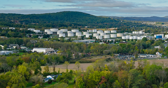 Aerial shot of a tank farm in Emmaus, a borough in Lehigh County, Pennsylvania, on an overcast day in Fall.