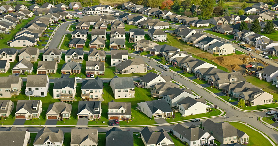 Aerial shot of tract housing in Emmaus, a borough in Lehigh County, Pennsylvania, on an overcast day in Fall.