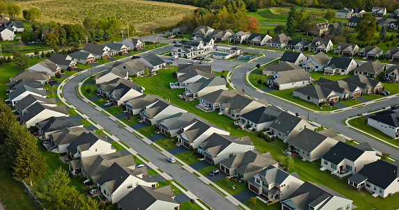 Aerial shot of tract housing in Emmaus, a borough in Lehigh County, Pennsylvania, on an overcast day in Fall.