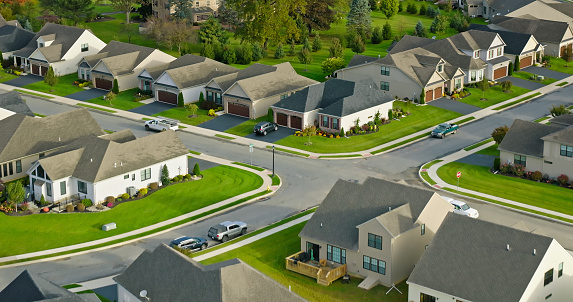 Aerial shot of tract housing in Emmaus, a borough in Lehigh County, Pennsylvania, on an overcast day in Fall.