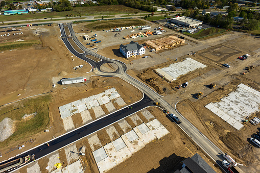 Aerial shot of suburban area under construction in Ann Arbor, Michigan on a sunny day in Fall. \nAuthorization was obtained from the FAA for this operation in restricted airspace.