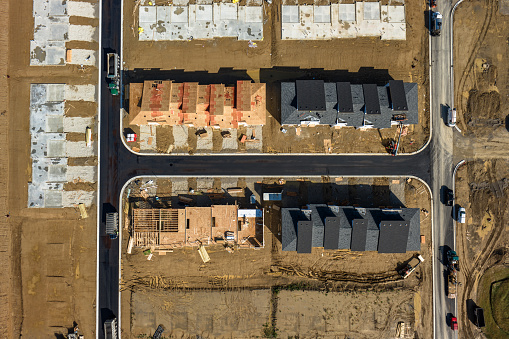 Aerial shot of suburban tract housing under construction in Ann Arbor, Michigan on a sunny day in Fall. 
Authorization was obtained from the FAA for this operation in restricted airspace.