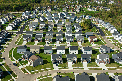 Aerial shot of suburban tract housing in Ann Arbor, Michigan on a sunny day in Fall. \nAuthorization was obtained from the FAA for this operation in restricted airspace.
