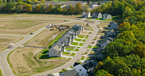 Aerial shot of suburban tract housing in Ann Arbor, Michigan on a sunny day in Fall. \nAuthorization was obtained from the FAA for this operation in restricted airspace.