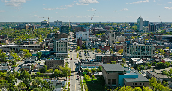 Aerial shot of downtown Ann Arbor, Michigan on a mostly clear day in Fall. \nAuthorization was obtained from the FAA for this operation in restricted airspace.