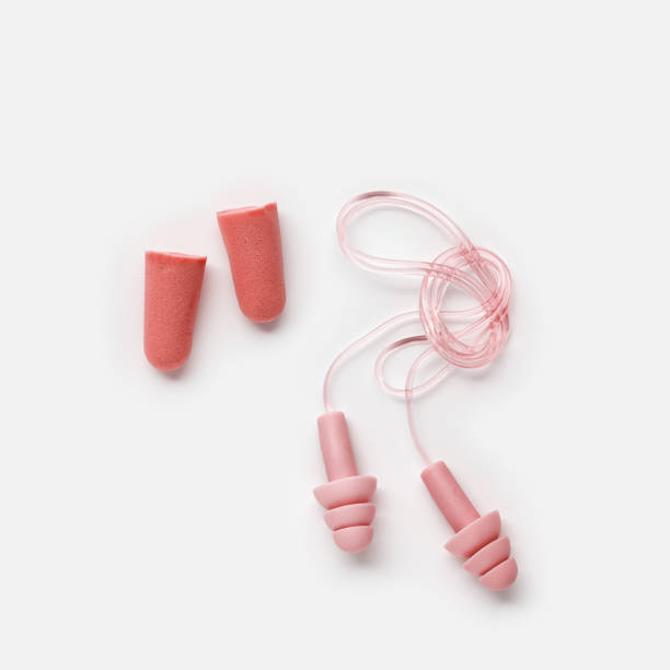 istock Set Colored earplugs on white background, reusable silicone and rubber ear plug on cord against noise, protect hear, for swim, sleep, rest. Creative aesthetic flat lay, above view, pastel tones 1893720047
