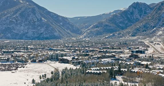 Aerial shot of Frisco, a town in Summit County, Colorado, on a clear day in Fall after a fall of snow.