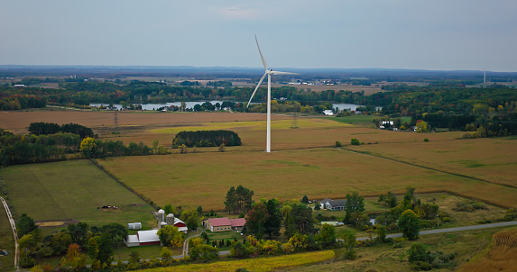 Aerial shot of wind turbine in a wind farm near Scottville, a city in Mason County in the U.S. state of Michigan, on an overcast day in Fall.