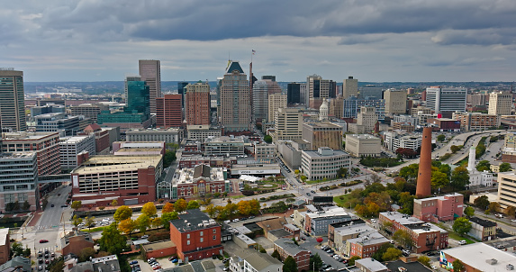 Aerial establishing shot of Baltimore, Maryland on an overcast day in Fall.