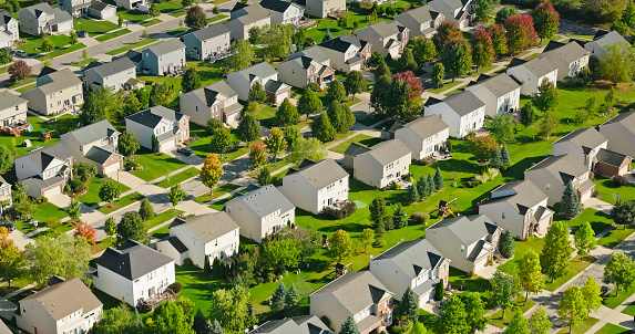 Aerial view of housing development in Chelsea in Washtenaw County, Michigan on a clear, sunny day in Fall.