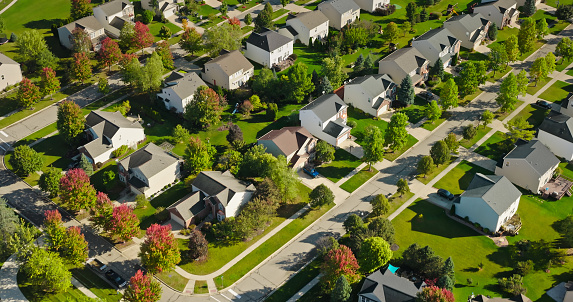 Aerial view of housing development in Chelsea in Washtenaw County, Michigan on a clear, sunny day in Fall.