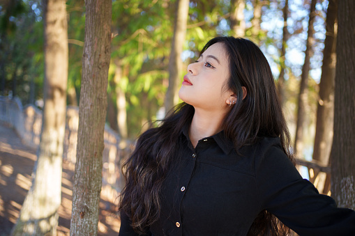 Asian woman in the woods
