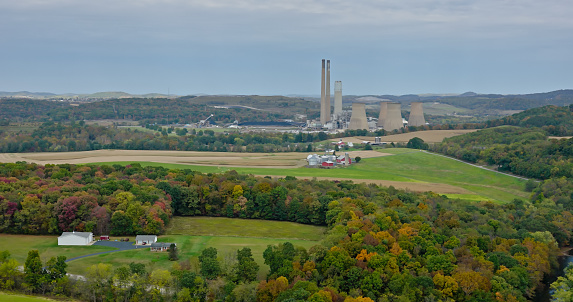 Aerial still of Keystone Generating Station, a coal power plant west of Shelocta, Pennsylvania, on an overcast day in Fall.