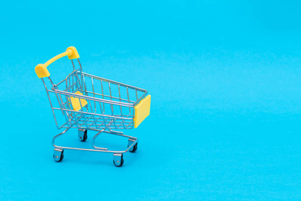 istock Empty Yellow Shopping Cart on Blue Background 1893808870