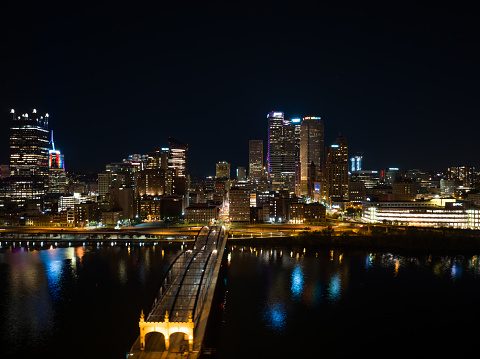 Aerial shot of downtown Pittsburgh, Pennsylvania skyline on a Fall night.