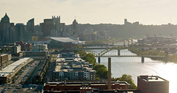 Aerial shot of downtown Pittsburgh, Pennsylvania from Strip District on a mostly clear day in Fall.