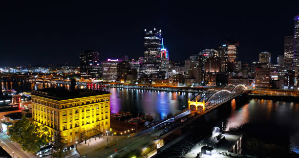 istock Aerial View of an Illuminated Downtown Pittsburgh behind Monongahela River on a Fall Night 1893811617