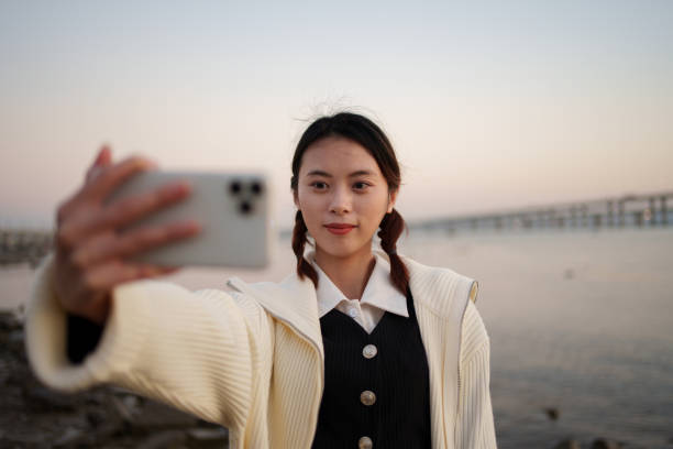 istock Young girl taking selfie at the beach 1893815284