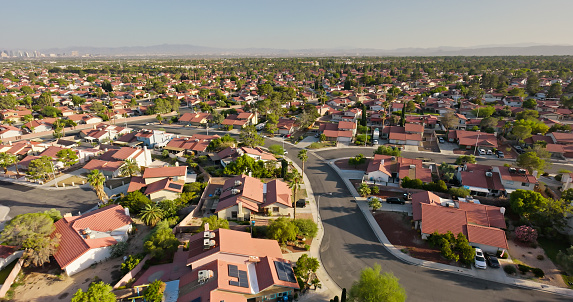 Aerial view of tract housing in the Angel Park neighborhood in Summerlin South, Clark County, Nevada, on a clear, sunny day in Fall.