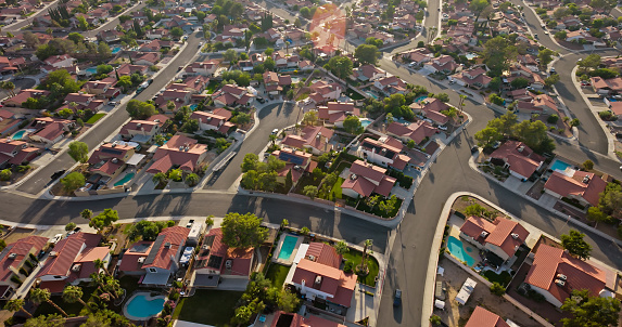 Aerial view of tract housing in the Angel Park neighborhood in Summerlin South, Clark County, Nevada, on a clear, sunny day in Fall.