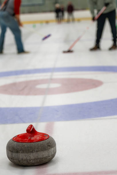 istock Curling rocks on sheet of ice 1893828877