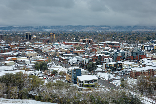 Aerial shot of downtown Fort Collins, Colorado on a snowy, overcast day in Fall.