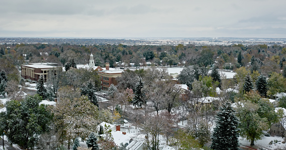 Aerial shot of Fort Collins, Colorado on an overcast, snowy day in Fall.