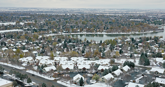 Aerial shot of Warren Lake in Fort Collins, Colorado on an overcast, snowy day in Fall.