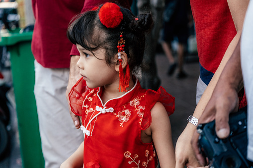 A little girl in traditional Chinese clothing to celebrate the Chinese New Year