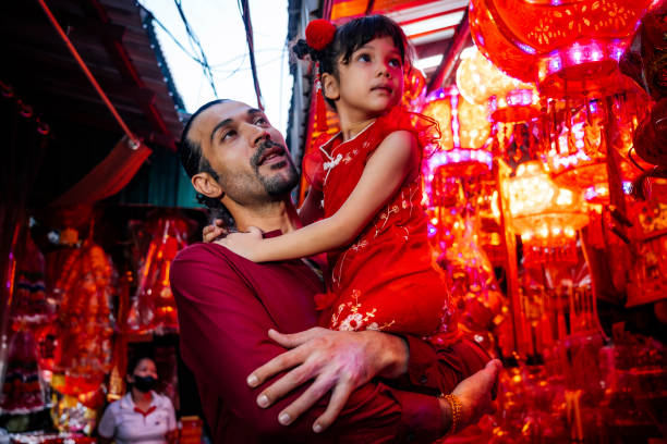 istock Father and daughter shopping in Chinatown 1893837751
