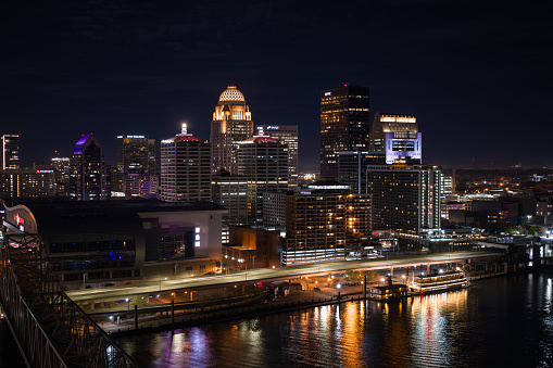 Aerial shot of downtown Louisville, Kentucky from over Ohio River on a Fall night.\n\nAuthorization was obtained from the FAA for this operation in restricted airspace.
