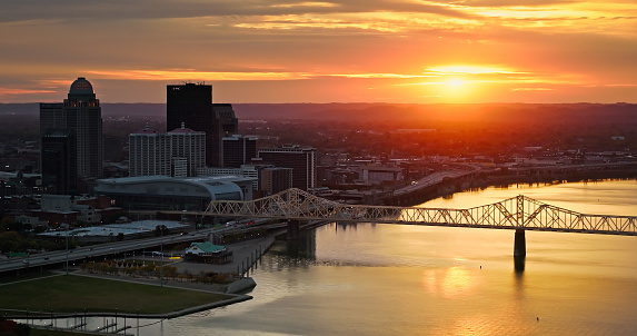Aerial shot of downtown Louisville, Kentucky and Ohio River on a Fall sunset.

Authorization was obtained from the FAA for this operation in restricted airspace.