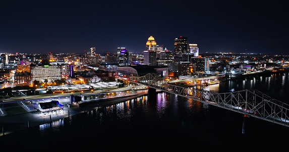 Aerial shot of downtown Louisville, Kentucky and Ohio River on a Fall night.

Authorization was obtained from the FAA for this operation in restricted airspace.