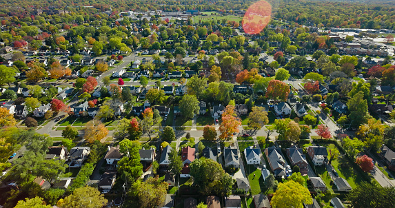 Aerial still of residential neighborhood in Oakwood, a small city in Montgomery County, Ohio, on a clear day in Fall.