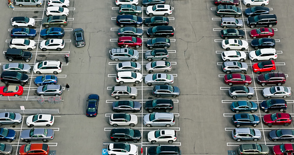 High angle aerial shot of a large parking lot connected to a retail park in Mayfield Heights, a suburb of Cleveland in Cuyahoga County, Ohio.