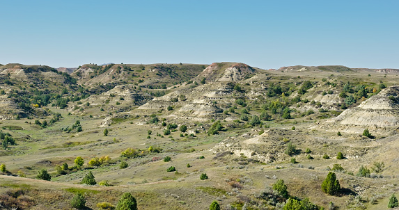 Aerial shot of natural landscape near Medora, a city in Billings County, North Dakota, on a clear, sunny day in Fall.