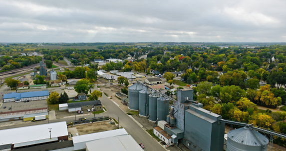Aerial still of Fergus Falls, a city in the Otter Tail County of Minnesota, on an overcast day in Fall.