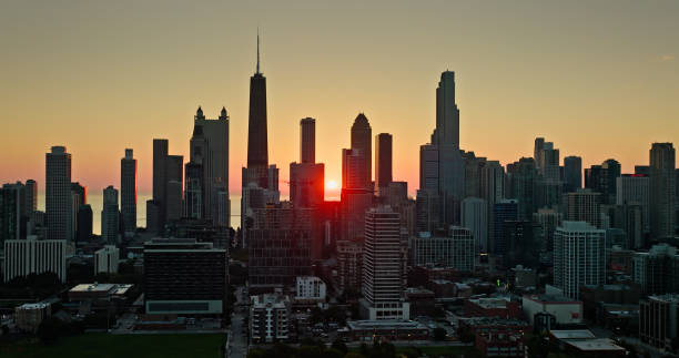 istock Chicago Skyline with Sun Peeping in Background at Dawn - Aerial 1893884775