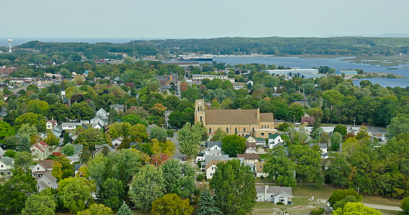 Aerial shot of Manistee, a small city in Manistee County in Southern Michigan on the shore of Lake Michigan on a clear day in Fall. Manistee is known as the \