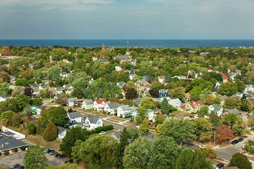 Aerial shot of Manistee, a small city in Manistee County in Southern Michigan on the shore of Lake Michigan on a clear day in Fall. Manistee is known as the \