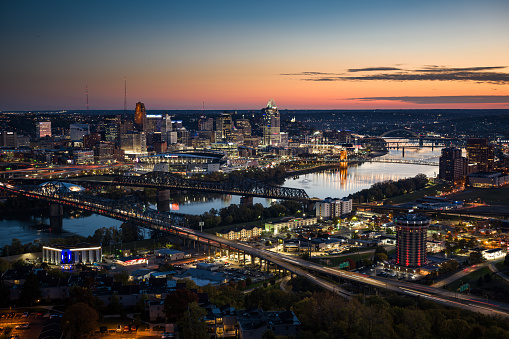 Aerial view of Downtown Cincinnati, Ohio and Covington, Kentucky at twilight before sunrise on a Fall morning.