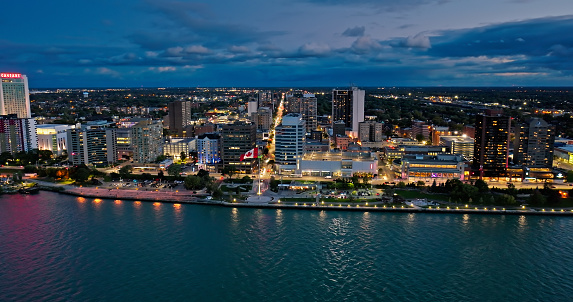 Aerial shot of City Centre in Windsor, Ontario, Canada at twilight in Fall from over Detroit River, Detroit, Michigan. Please note that this shot was taken from within US airspace by a FAA licensed drone pilot.