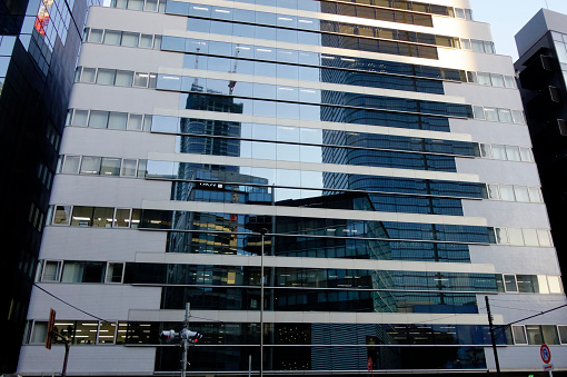 Urban, building shape reflected on mirror wall