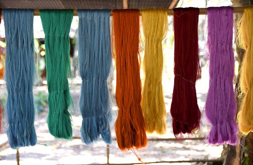 Silk threads are dyed in a variety of colors. Hang to dry.