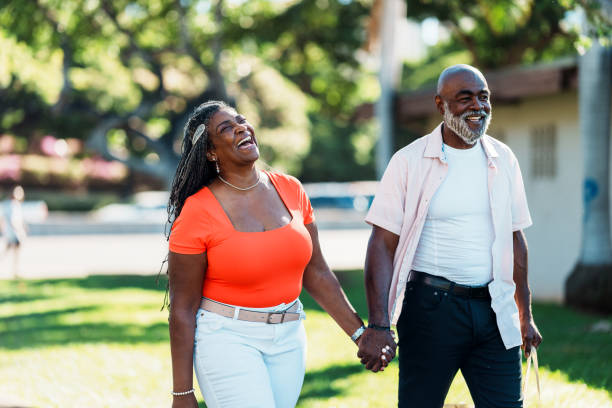 istock Vibrant senior couple laughing together while on a relaxing walk 1894050687