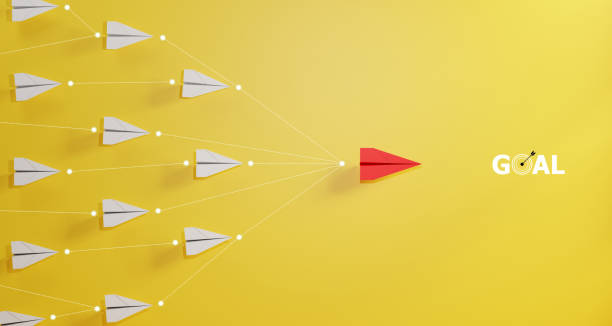 istock Leadership concept, red leader plane leading white plane, on yellow background. 1894074403